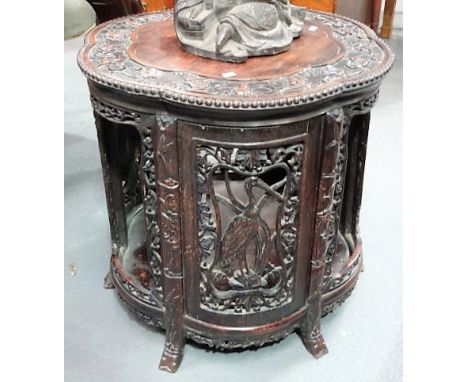 Good 19th Century Chinese hardwood two-tier circular lobed table, the lobed top with carved edge with gourds and bats amongst