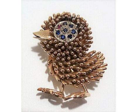 14k rose gold ruby and sapphire set Mid Century brooch modelled as a stylised chick, the white gold eye set with seven small 