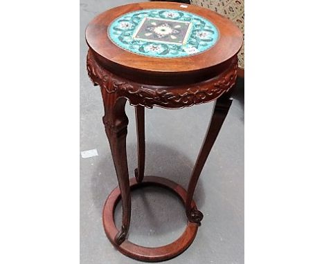 Pair of 20th Century Chinese hardwood circular torchieres, the circular tops inset with foliate scroll cloisonné foliate pane
