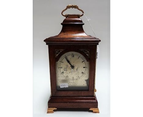 Small mahogany case bracket style clock, the silvered 3.25in arched dial signed Carter, Hart Street, London, the caddy top wi