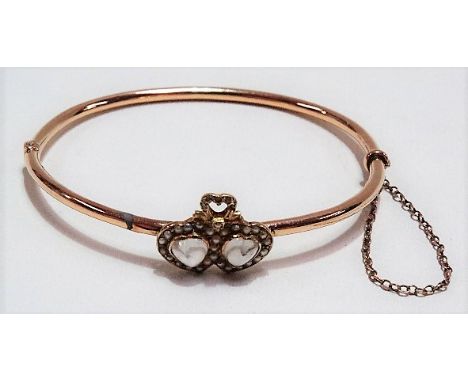 Attractive 9ct gold moonstone and seed pearl set hinged bangle applied with twin conjoined hearts, weight 7.4g approx