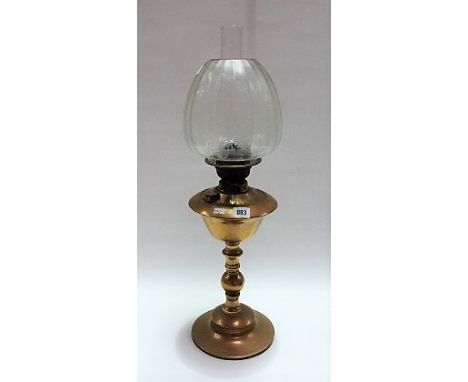 Brass oil lamp with etched clear glass shade, height 59cm.
