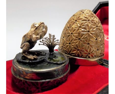 Good modern silver gilt egg by Stuart Devlin, the textured gilded case with floral punched motifs revealing a sprung frog on 