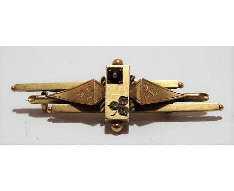 Victorian 15ct gold bar brooch set a ruby and three chipped diamonds formed as a three-leaf clover, width 15mm, weight 4.5g a