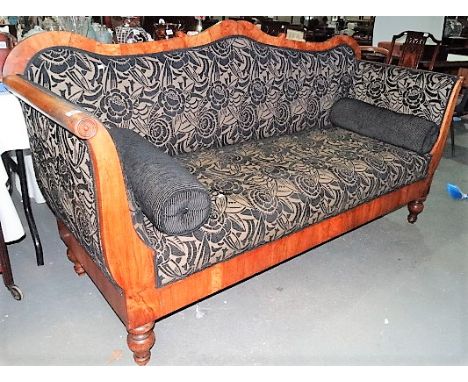 Biedermeier settee, the shaped top over outswept arms with upholstered back, seat and arms raised on four turned legs, width 