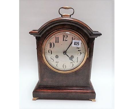 Oak cased bracket style two-train clock with 5.5in silvered dial and brass carrying handle, height 36cm