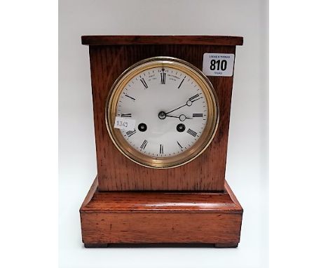 Oak cased two-train clock, the 4in white enamel dial with Roman Numerals signed Chas Frodsham to the Queen, the French moveme