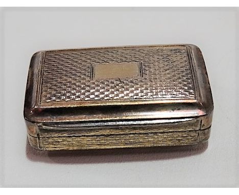 George III silver gilt vinaigrette, engine turned, hinged to reveal a foliate engraved and pierced grill, maker IS, Birmingha