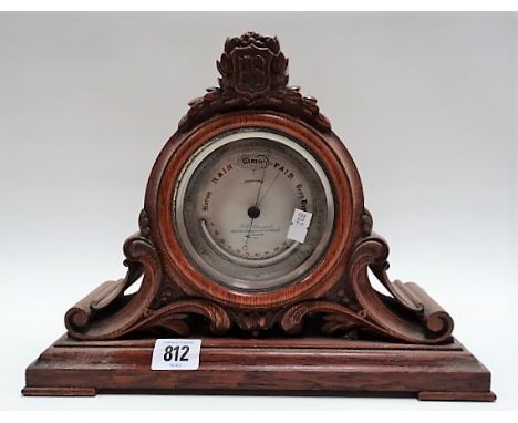 Victorian aneroid mantel barometer thermometer within foliate carved oak case, the 4in silvered dial signed P.H. Steward 406 