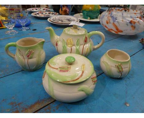 A four piece Avon ware Art Deco Teapot, Sugar and Cream and lidded Bowl