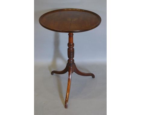 A Regency Mahogany Occasional Table, the moulded dish top above a ring turned column and outswept legs, 48 cms diameter 