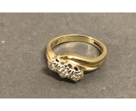 A 9ct. Gold Three Stone Diamond Crossover Ring 