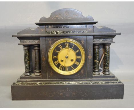 A Large Black Slate and Marble Mantle Clock, the dial with Roman numerals and two train movement flanked by turned columns 