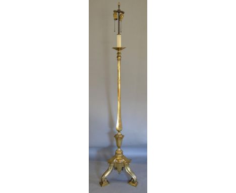 A Late 19th or early 20th Century Brass Lamp Standard in the 18th Century style, the tri form base with scroll feet, 178cms t