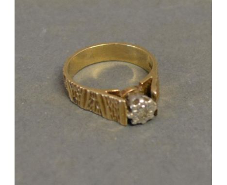 A 9ct. Yellow Gold Solitaire Diamond Ring, set single diamond in a star setting 