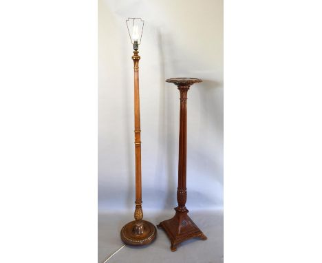 An Early 20th Century Mahogany Torchere with a reeded column and raised platform base, together with a lamp standard 