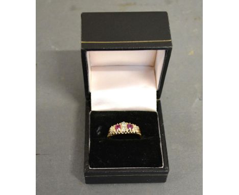 An 18ct. Yellow Gold Diamond and Ruby Ring set with two rubies and four diamonds within a pierced setting 