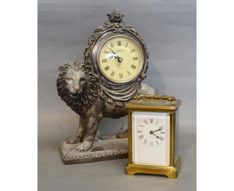 A French Brass Cased Carriage Clock, the enamel dial with Roman numerals and with lever escapement together with a reproducti