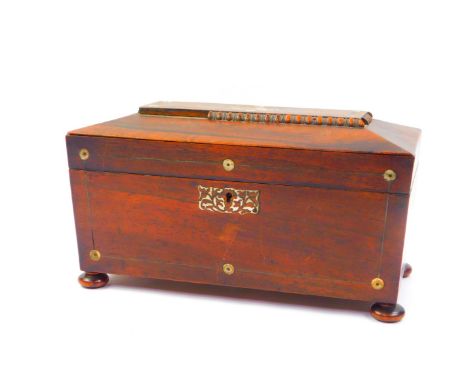A Regency rosewood and mother of pearl inlay tea caddy, of sarcophagus form, the hinged lid opening to reveal a pair of compa