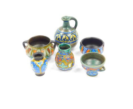 A Gouda pottery jug, decorated in the Liberty pattern, two vases decorated in the Beek and Beha patterns, pedestal cup decora