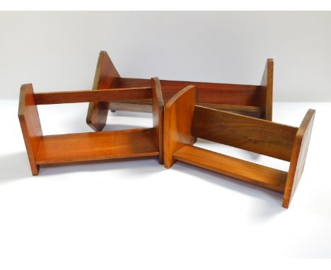 A mahogany book trough, 49cm W., walnut book trough, 30.5cm W., and a further book trough with leaf carved ends, 32cm W. (3)