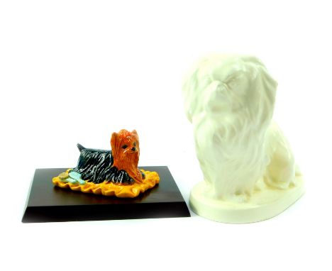 A Spode Velamour white glazed figure of a Pekingese dog, K529, printed and raised marks, 17cm W, together with a Royal Doulto