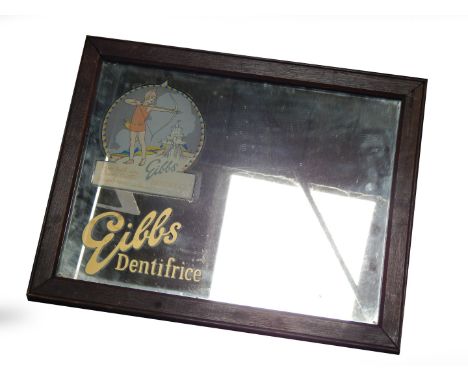 A 1930's advertising wall mirror for Gibbs Dentifrice, with a girl by an enchanted castle pulling a bow and arrow, "Your teet