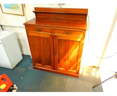 A Victorian mahogany chiffonier, with a shelf back over two drawers above panelled cupboard doors, raised on a plinth base, 1