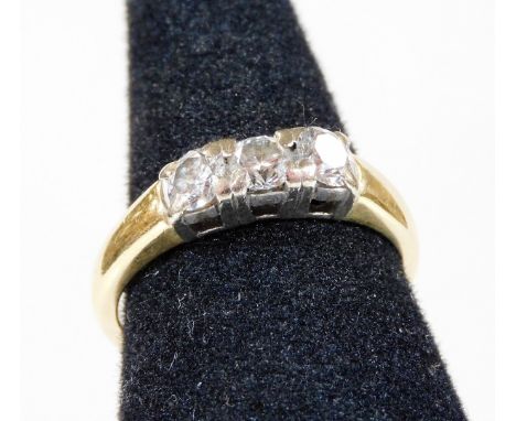 An 18ct gold three stone diamond ring, set with three round brilliant cut diamonds, in platinum setting, each stone approx 0.