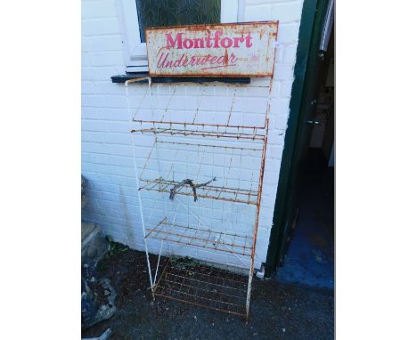 A mid 20thC cast iron shop display stand, for Montfort Underwear, with three tiers and an under shelf, 153.5cm H, 60.5cm W, 2