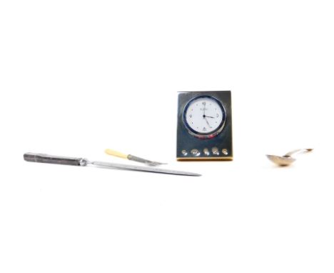 A Carrs silver fronted strut bedside clock, circa 2000, 7cm H, 5.5cm W, together with a silver paper knife, Sheffield 1973, V