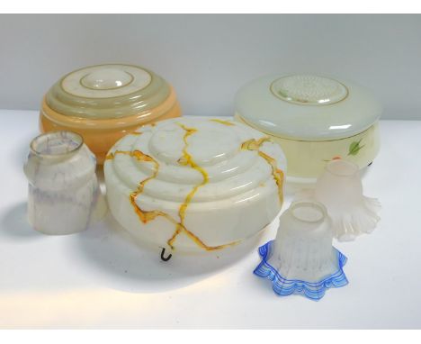 Three mid 20thC glass ceiling lights, variously decorated, each 30cm Dia, two with hanging chains, together with three glass 