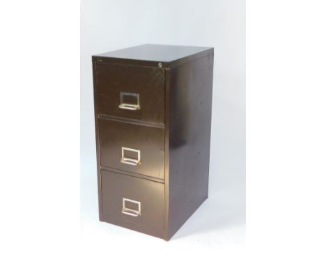 A brown metal three drawer filing cabinet, with keys, 100.5cm H, 47cm W, 51.5cm D.