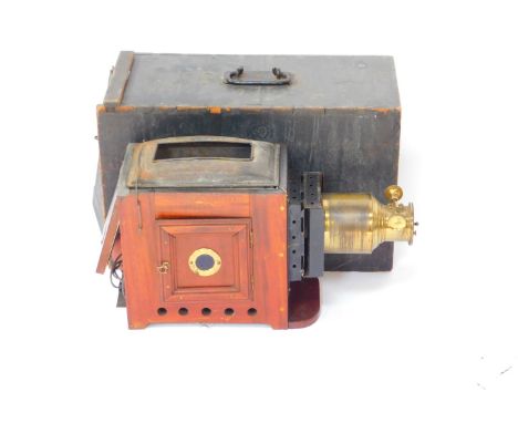 A Victorian mahogany cased magic lantern, with brass adjustable lens, cased, 44cm W.