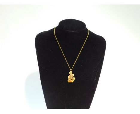 A 9ct gold "½oz" pendant, of abstract polished and textured form, on a curb link neck chain, with bolt ring clasp, 18.4g.