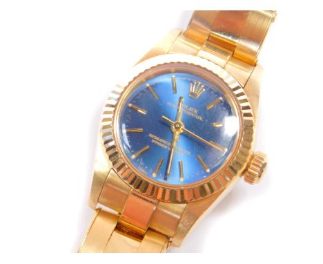 A Rolex Oyster Perpetual lady's 18ct gold wristwatch, having a blue lustre dial with centre seconds, marked superlative chron