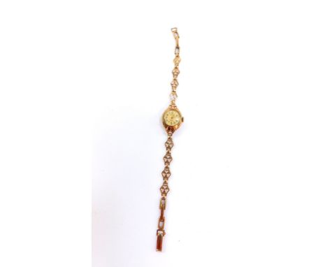 A Rotary lady's 9ct gold cased wristwatch, circular dial bearing Arabic numerals, 17 jeweled movement, on a 9ct gold fancy li