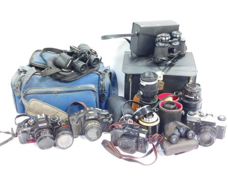 A group of cameras including a Zenite M camera, Nikai PBS 35mm System camera, Ricoh KR10 camera, together with other lenses, 