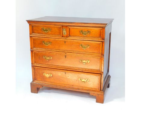 A Georgian early 18thC oak chest of drawers, with two short over three long graduated drawers, raised on bracket feet, 91.5cm