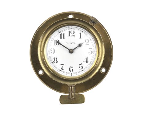 An 8-day angled dashboard mechanical clock,in a brass case with a 2 1/2 inch diameter white porcelain enamel dial (hairline c