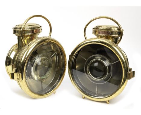 A pair of BRC model 1457 acetylene headlamps, circa 1905,each polished brass body with fork mounts, loop handle, chimney, con