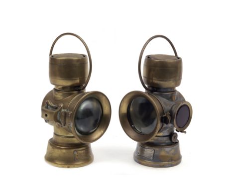 Two Lucas oil illuminated number-plate rear lamps,each brass body with drum chimney, comprising model 631 (with bullseye lens