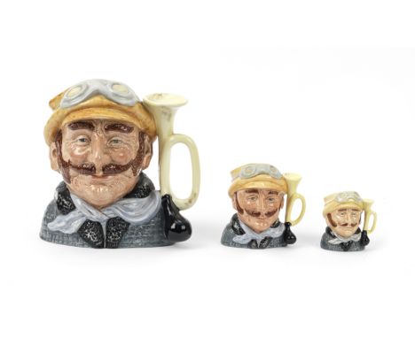 A set of Royal Doulton 'Veteran Motorist' jugs, 1972,each glazed ceramic, three graduated sizes in small 7cm high, medium 10c