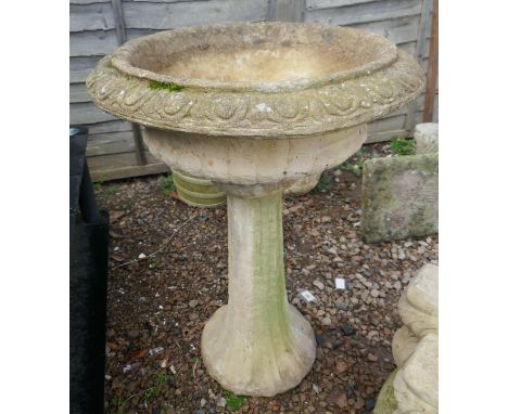 Large stone planter on plinth 