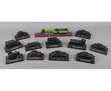 A collection of E &amp; J Collectables Ltd coal models of vehicles along with a model of the Flying Scotsman steam train.  