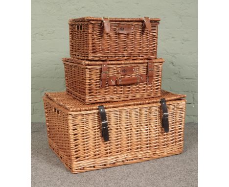Three wicker picnic hamper baskets, to include two Regency Hampers examples. Largest - Height: 31cm, Width: 62cm, Depth: 44cm