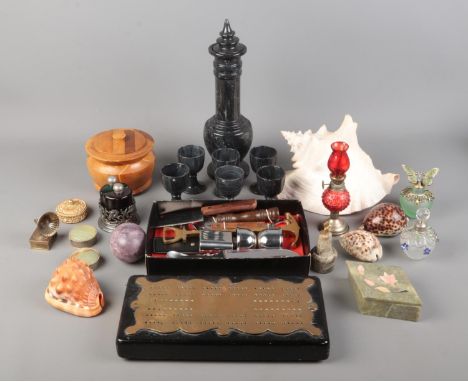 An assortment of collectables, to include cribbage board, shells, scent bottles and miniature oil lamp etc.  