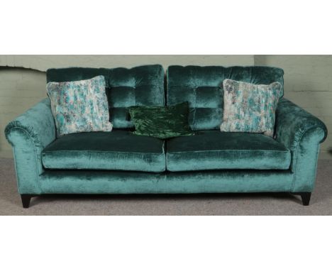 A teal velvet upholstered three seat sofa. (80cm x 225cm x 95cm)  