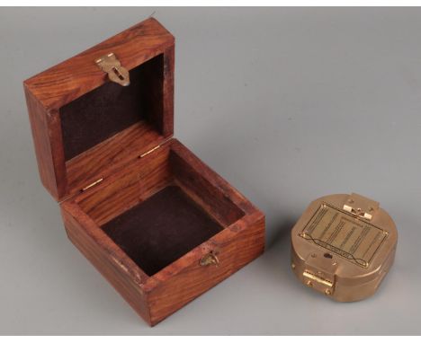 A cased Stanley London natural sine brass cased compass with dual spirit level. Features engraved natural sine table to outer