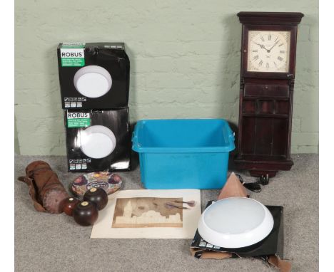 A box of assorted items, to include quartz wall clock, salt lamp, vintage darts, wall lights and lawn bowls.  